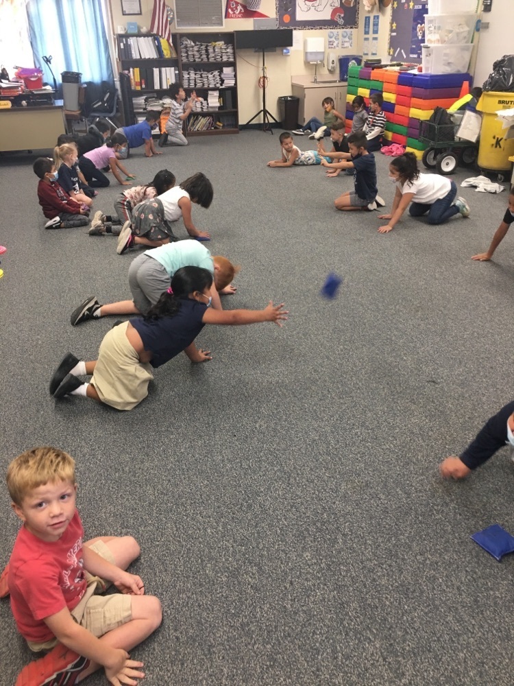 students learning how to play floor hocke